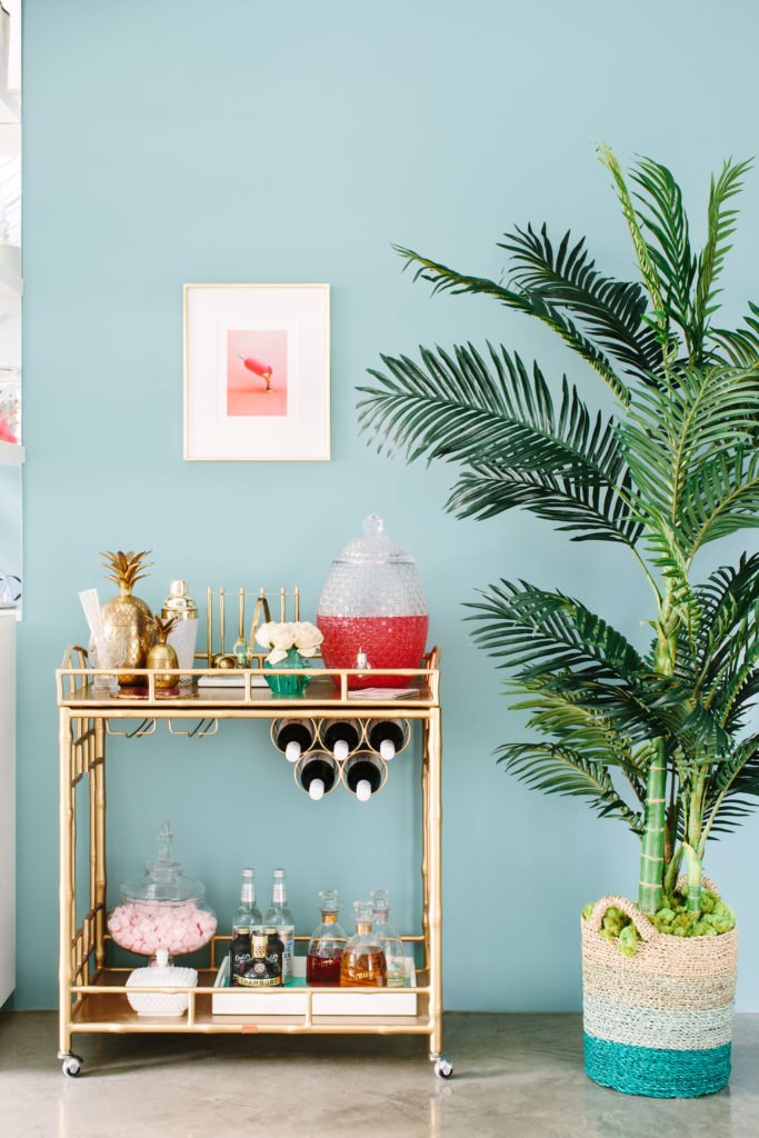 How to Achieve the Casual Glamour Look Society Social gold bar cart blue and green color palette faux interior palm tree
