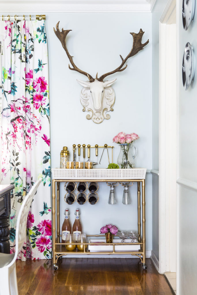 How to Achieve the Casual Glamour Look  Gold Society social bar cart with faux deer head designers guild shanghai garden drapes 